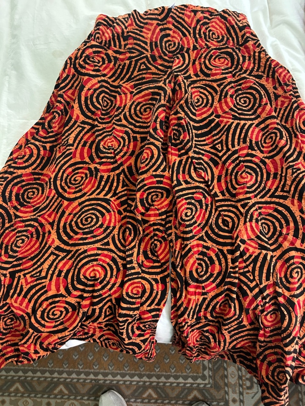 Womens Ankle Crop Pants in Black and Orange Spiral Print